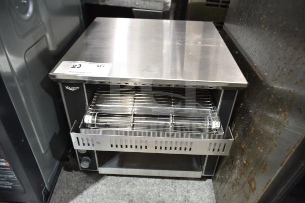 "Vollrath commercial conveyor toaster oven, brand new with minor scratches. Visible control knobs, stainless steel finish."