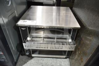 "Vollrath commercial conveyor toaster oven, brand new with minor scratches. Visible control knobs, stainless steel finish."