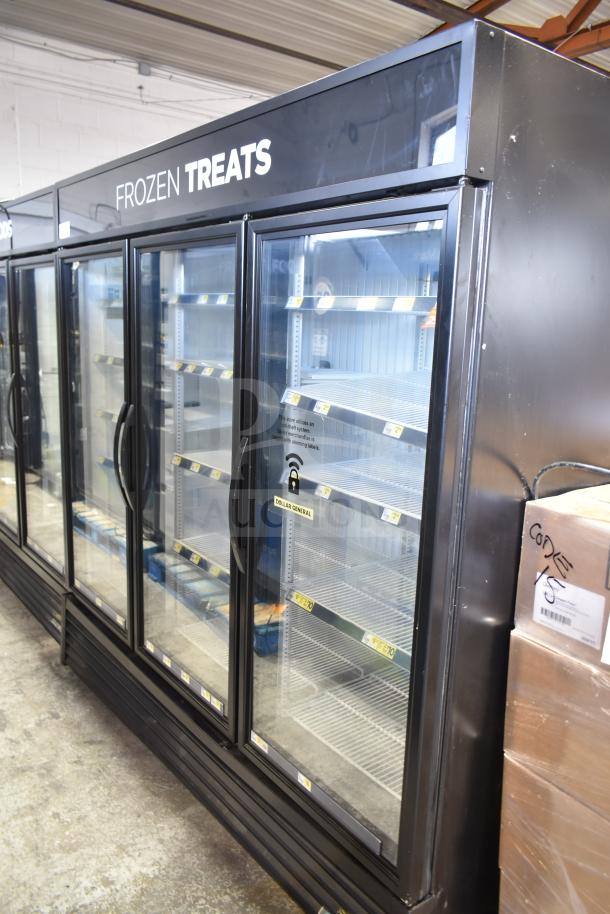 2019 True GDM-72F-HC 3-door reach-in freezer merchandiser, black, glass doors, “Frozen Treats” sign on top.