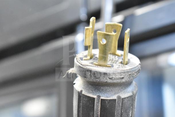 Close-up of power plug for 2019 True GDM-72F-HC Commercial Freezer. Features prongs for 115/208-230V, 1 Phase use.