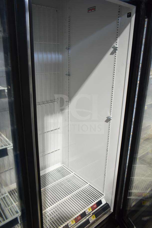 2019 True GDM-72F-HC 3 Door Reach In Freezer Merchandiser, white interior, model labeling, good condition.