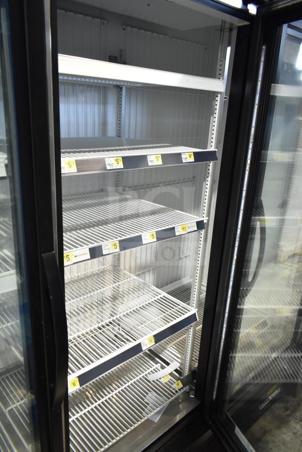 2019 True GDM-72F-HC 3 Door Reach In Freezer, commercial-grade, white interior, multiple shelves.