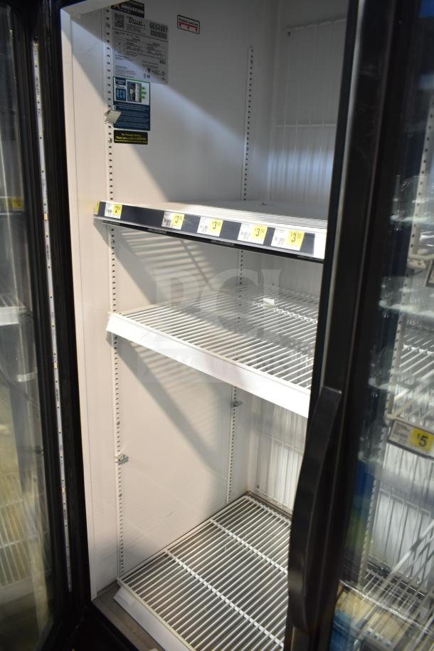 2019 True GDM-72F-HC 3-door reach-in freezer merchandiser, 115/208-230V, 1 phase. Clean shelves, interior, visible labels.