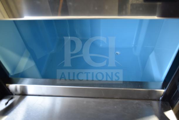 Brand new Avantco 194EUCH160A commercial ice machine interior, 44 lb. bin. Notable dent visible on edge.