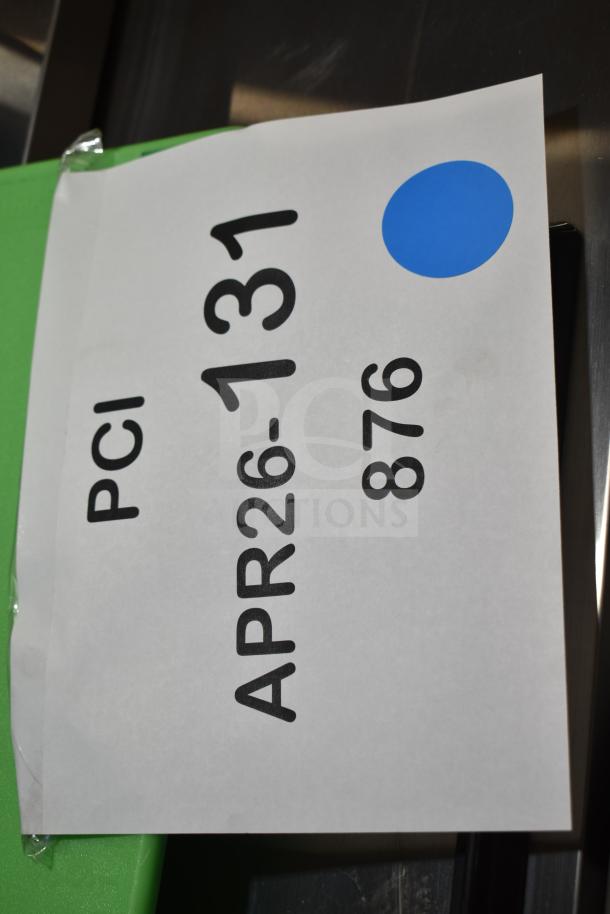 Label showing "PCI", "APR26-131", "876" on a green background, partially taped.