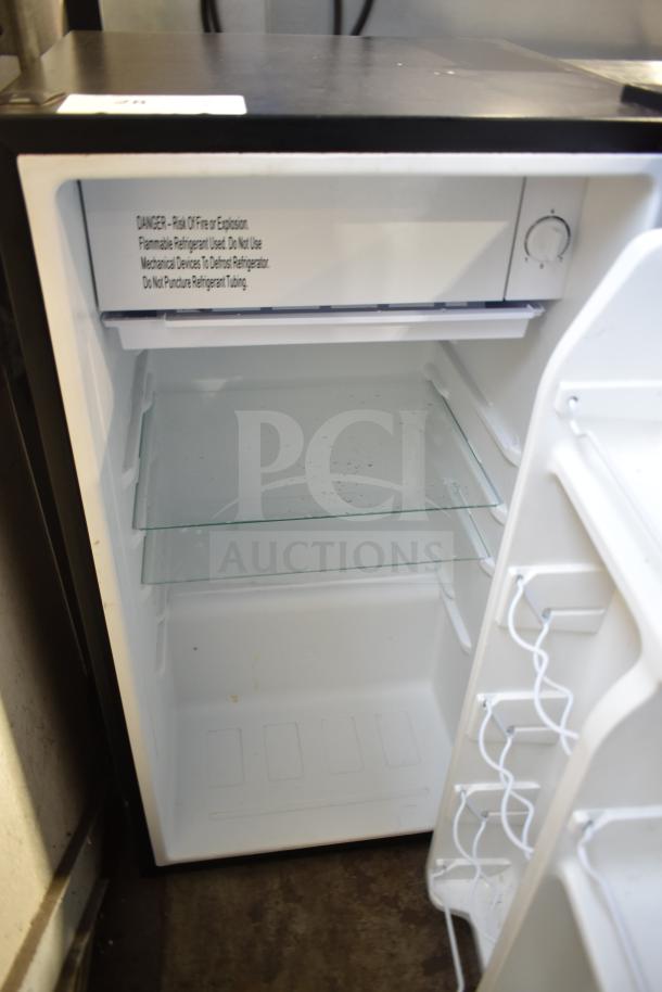 Galanz GLR33MBKE23 mini cooler, open view. Features glass shelf and side door storage. 115 volts, 1 phase.