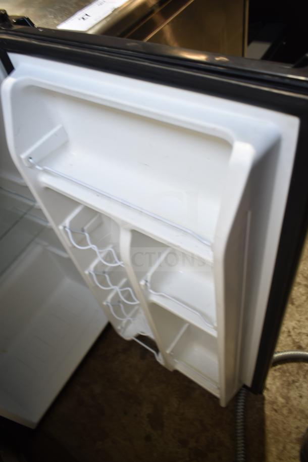 Galanz GLR33MBKE23 Mini Cooler, open door view with shelves; model details visible. In good condition. 115 Volts, 1 Phase.