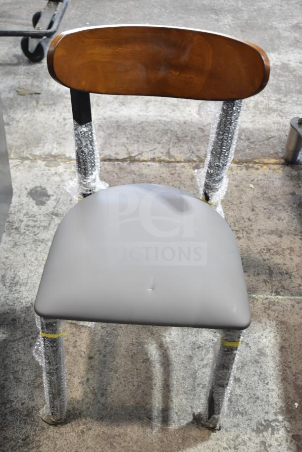 New Lancaster Boomerang dining chair, model 164CBMRGBFRN, with wooden backrest, gray cushion, metal frame, wrap protection.