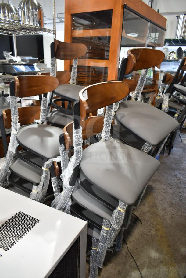 14 new Lancaster chairs, model 164CBMRGBFRN, with wooden backrests, gray cushions, and metal frames. Scratch and dent condition.