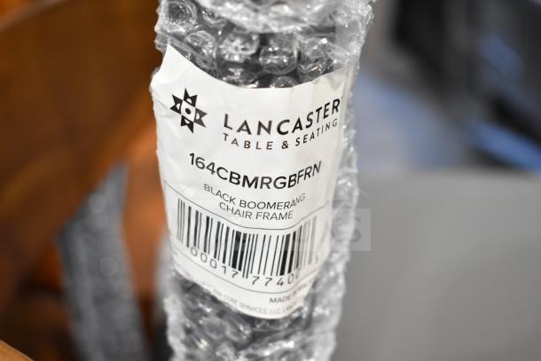 Lancaster Table & Seating 164CBMRGBFRN chair label, bubble wrap packaging, indicating a black boomerang chair frame.