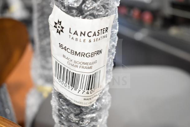 Brand new Lancaster Boomerang Chair, model 164CBMRGBFRN, with wood back, gray cushion, metal frame. Packaged, labeled.