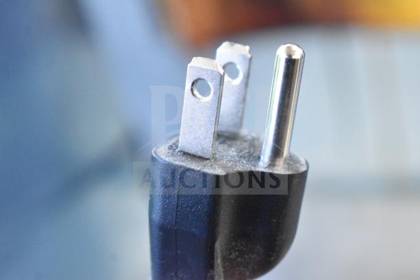 Close-up of a power plug for the Avantco 177CU100ETL coffee urn, showing a three-prong design.