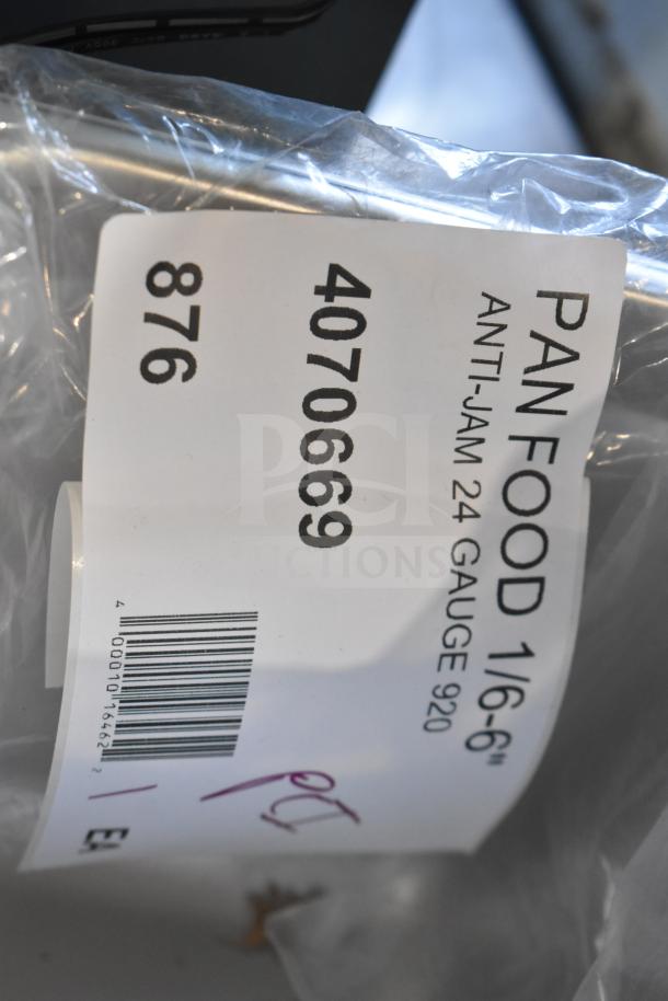 Anti-jam stainless steel pan with label "4070669, Pan Food 1/6-6'', 24 Gauge". Brand new, ideal for commercial kitchens.