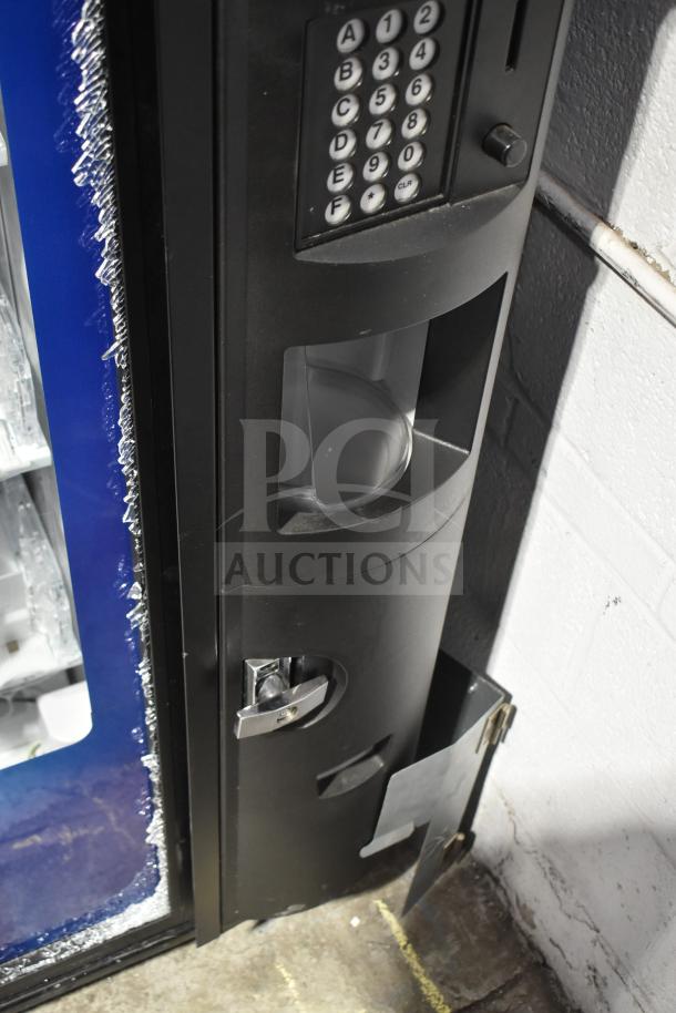 Crane 5800-4 commercial vending machine, visible keypad and bill acceptor, signs of damage on edges, 115 volts, 1 phase.