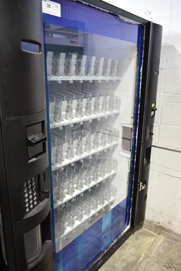 Crane 5800-4 commercial vending machine, bill acceptor, 115V, 1 phase, visible damage, clear shelves, black exterior.