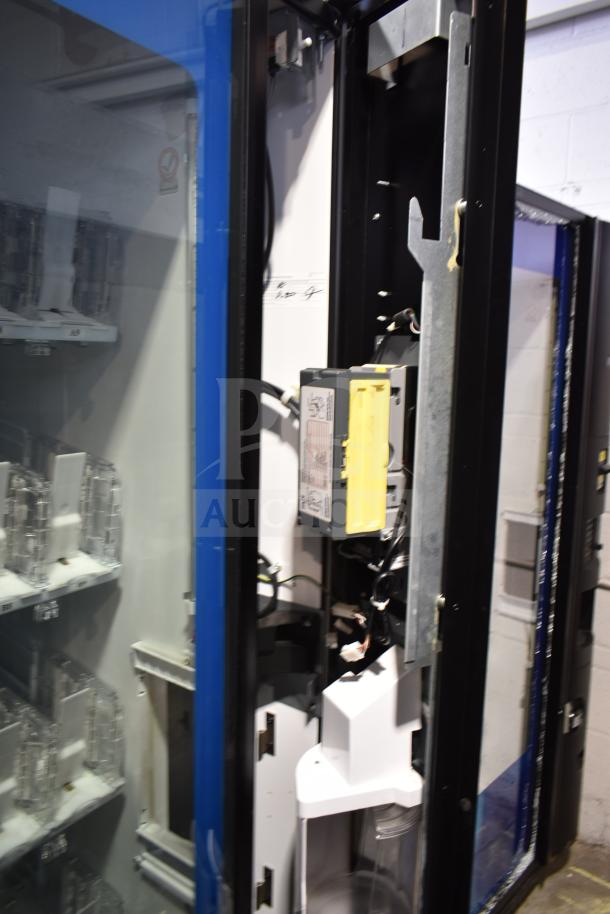 Crane 5800-4 commercial drink vending machine with bill acceptor, door does not close. 115 volts, 1 phase. Visible interior mechanics.