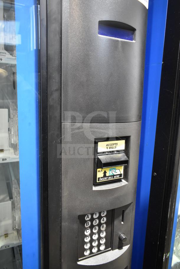 Crane 5800-4 vending machine, black with bill acceptor, keypad, 115 volts, 1 phase, commercial condition.