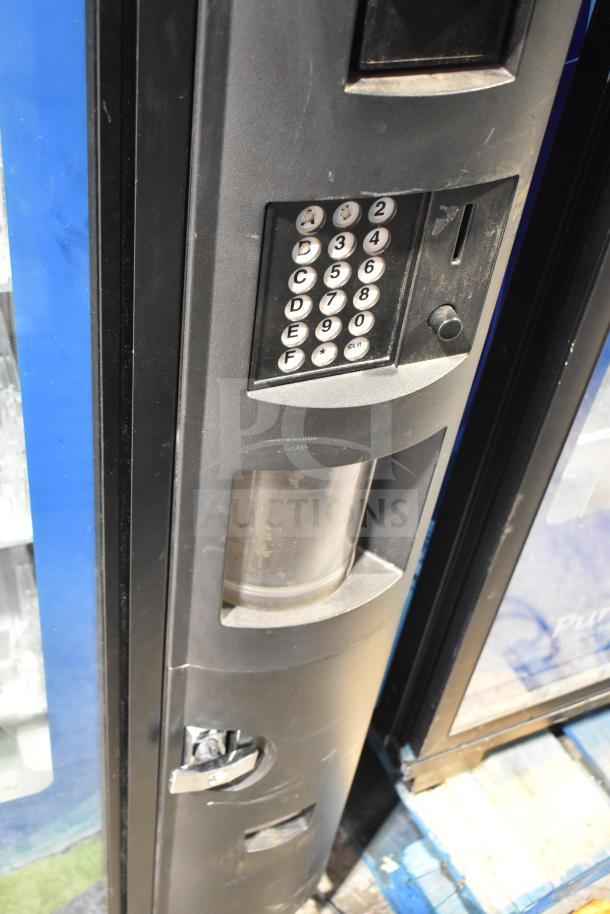 Crane 5800-4 commercial bottled drink vending machine with bill acceptor, keypad interface; used condition.