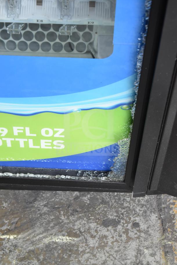 Crane 5800-4 vending machine with glass damage, bill acceptor, operates at 115 volts, 1 phase.