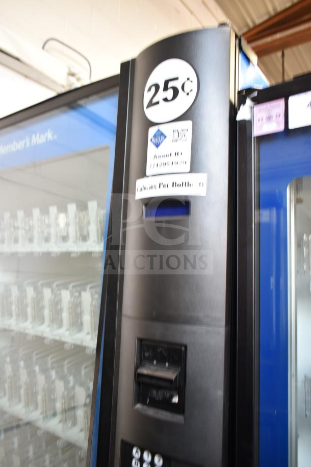 Crane 5800-4 commercial vending machine, accepts bills, 115V, 1 phase, visible pricing at 25 cents, sleek black exterior.