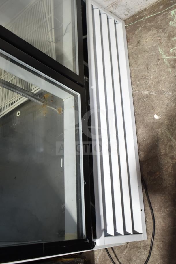 So-Low DHF4-49GD Commercial 2 Door Reach-In Freezer. Glass doors, 115V, 1 Phase, good condition.