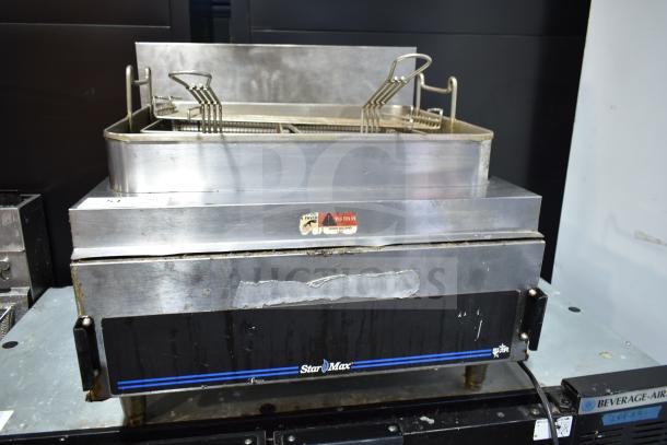 Star Max Countertop Deep Fat Fryer with baskets, stainless steel design, visible wear, includes safety warning label.