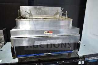 Star Max Countertop Deep Fat Fryer with baskets, stainless steel design, visible wear, includes safety warning label.