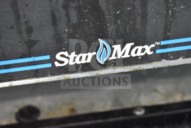 Star Max logo on a black countertop deep fat fryer. Visible wear suggests used condition.