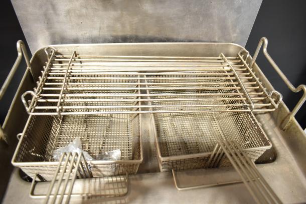 Star Max countertop deep fat fryer with two wire baskets, showing signs of use. Ideal for small kitchens.