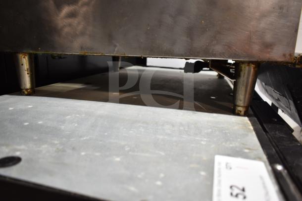 Star Max Countertop Deep Fat Fryer with baskets, featuring metal legs. Some rust and wear visible on the legs.