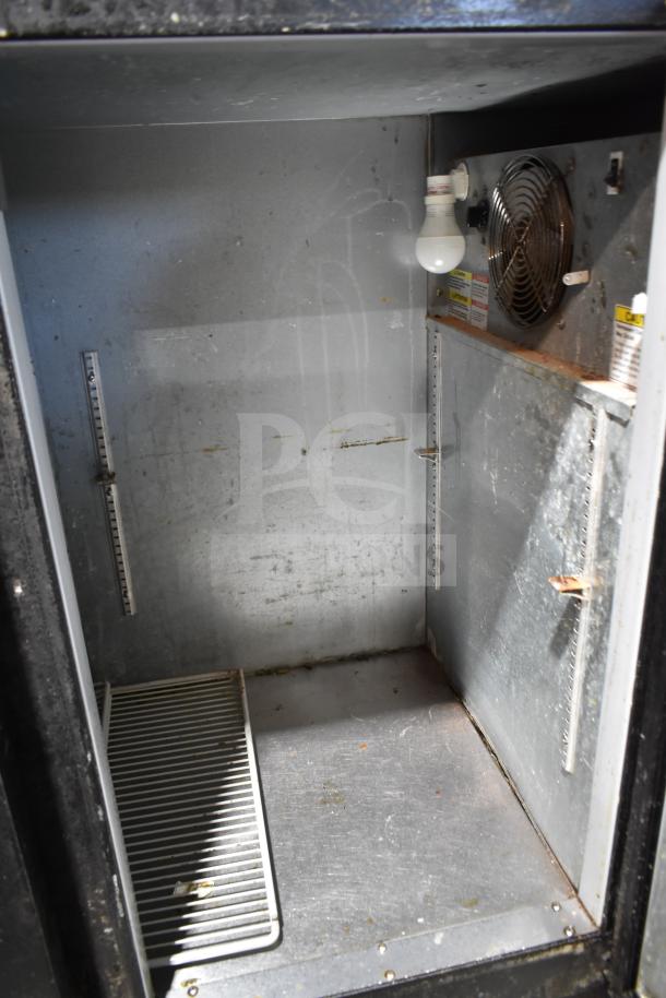 Beverage Air BB48Y-1-B 2-door back bar cooler interior, visible wear, shelving brackets, cooling fan, and light bulb.