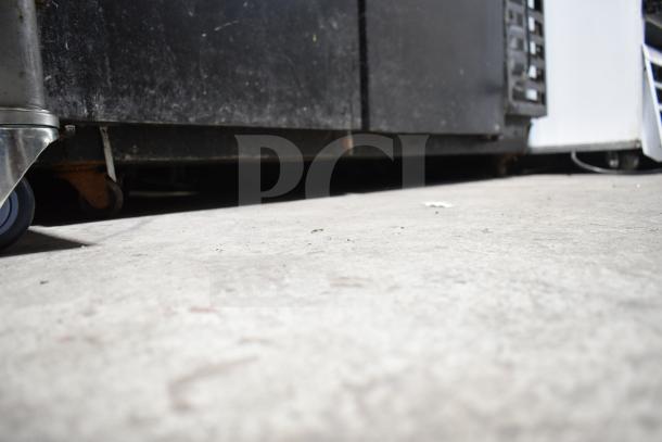 Beverage Air BB48Y-1-B undercounter cooler; 2-door, black exterior, commercial use, 115 volts, 1 phase, visible wear.