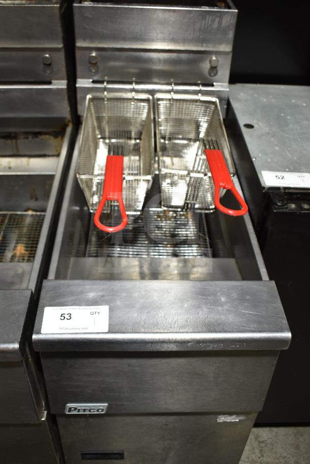 Pitco Frialator commercial gas fryer on casters with dual fryer baskets and red handles. Auction tag visible with item info.