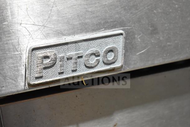 Pitco Frialator logo on a commercial gas-powered deep fat fryer, showing metal surface condition and brand details.