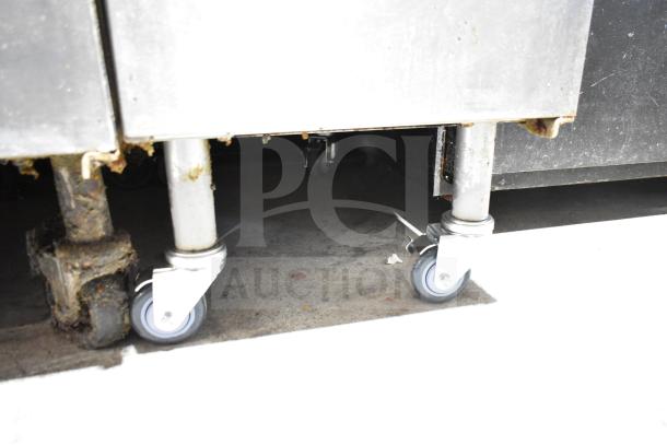 Pitco Frialator commercial gas fryer on casters, stainless steel, showing signs of use, suitable for restaurant kitchens.