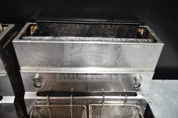 Pitco Frialator commercial gas deep fat fryer on casters, stainless steel, visible signs of use, includes fryer baskets.