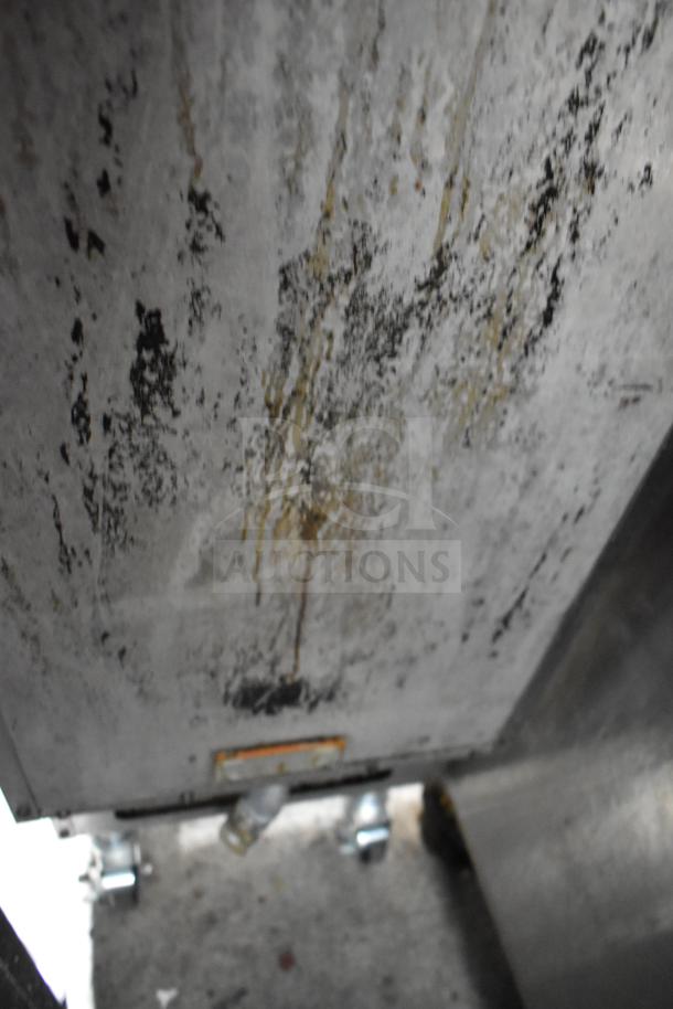 Pitco Frialator gas-powered deep fat fryer on casters, signs of wear and discoloration, suitable for commercial use.