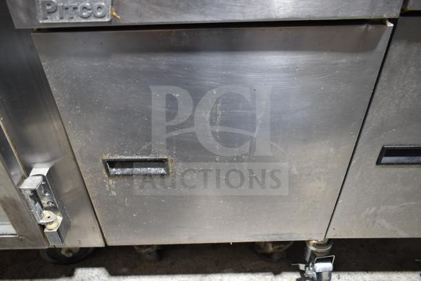 Pitco Frialator gas-powered deep fat fryer on commercial casters, used, visible wear, stainless steel finish, Pitco logo.