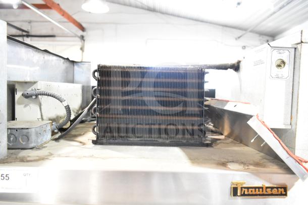 Traulsen RHT 2-32NUT reach-in cooler compressor, dual voltage, stainless steel, visible branding, used condition.