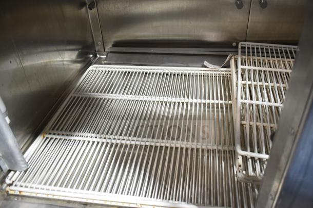Traulsen RHT 2-32NUT commercial reach-in cooler interior, showing stainless steel shelves. 115V, 1 Phase.