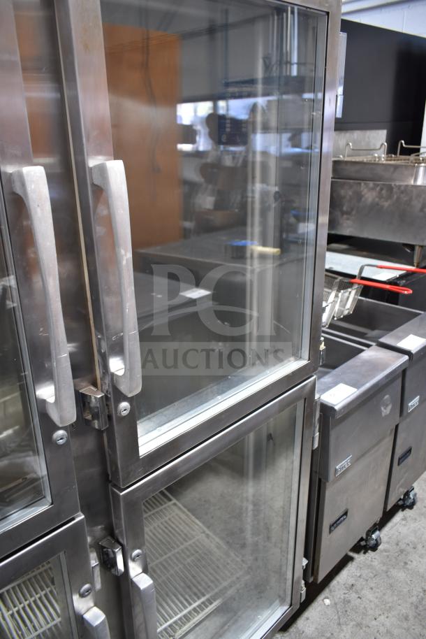 Traulsen RHT 2-32NUT commercial reach-in cooler with four half-size glass doors, stainless steel exterior. 115V, 1 phase.
