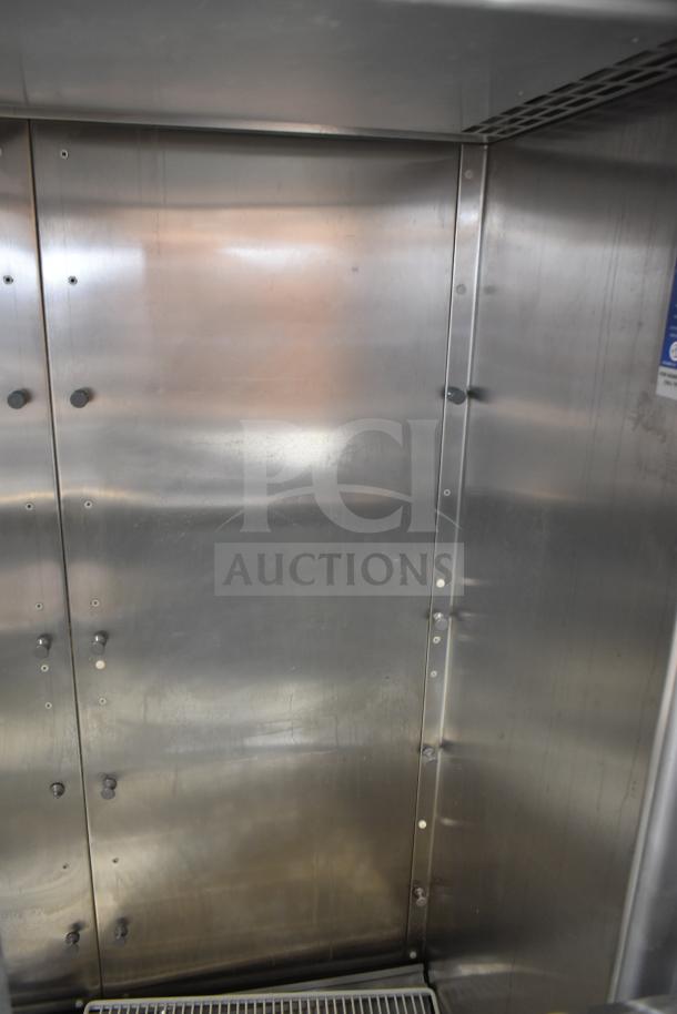 Traulsen RHT 2-32NUT reach-in cooler interior, stainless steel, clean, with visible vents, for commercial use.