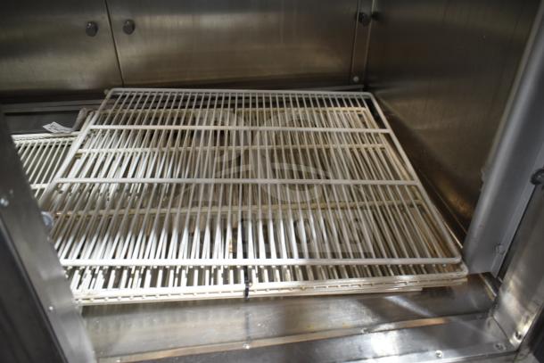 Traulsen RHT 2-32NUT commercial reach-in cooler interior with wire shelving, stainless steel finish, 115 volts, 1 phase.
