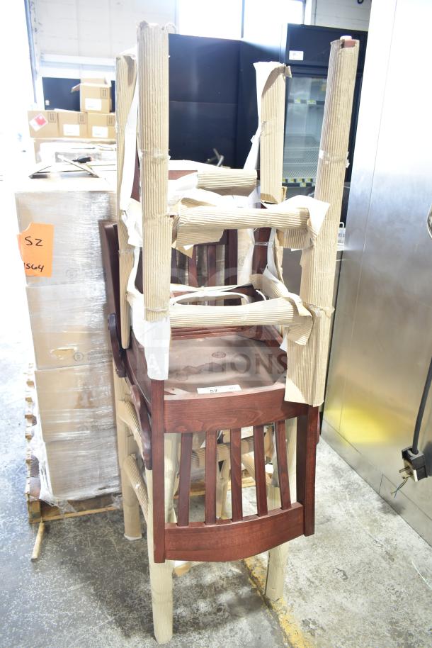 2 brand new scratch and dent wooden bar height chairs, packaged, dark finish, visible protective wrap, auction item.