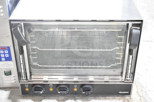 Brand new Vollrath COV-120-HS half-size countertop convection oven, 120 volts, showing control knobs and interior racks.