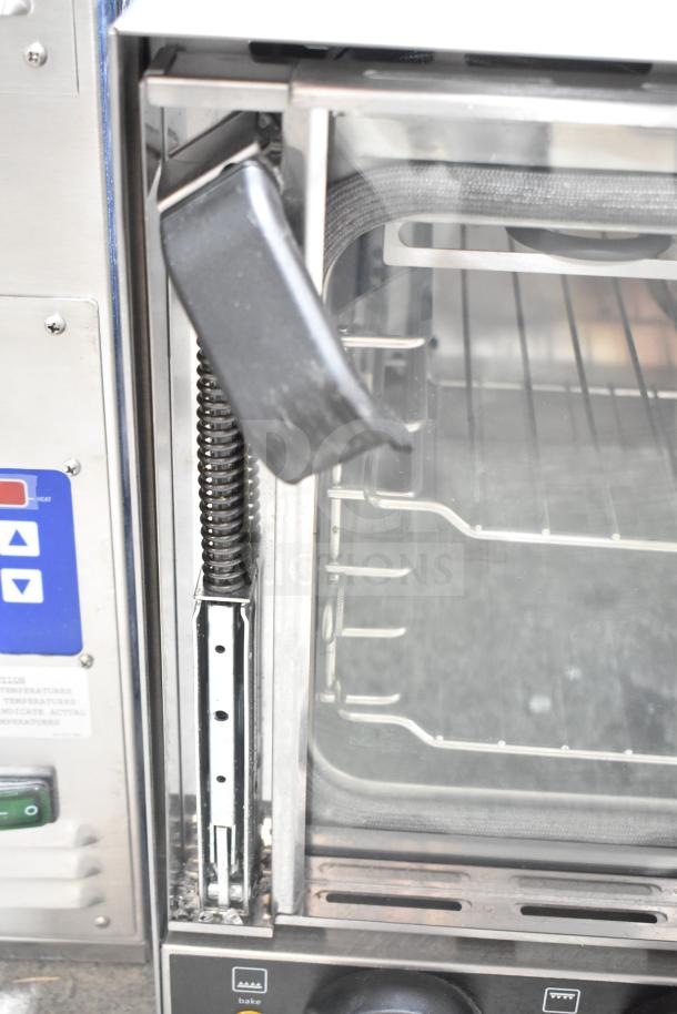 Brand new Vollrath COV-120-HS half size countertop convection oven, showing control panel, spring hinge, and interior racks.