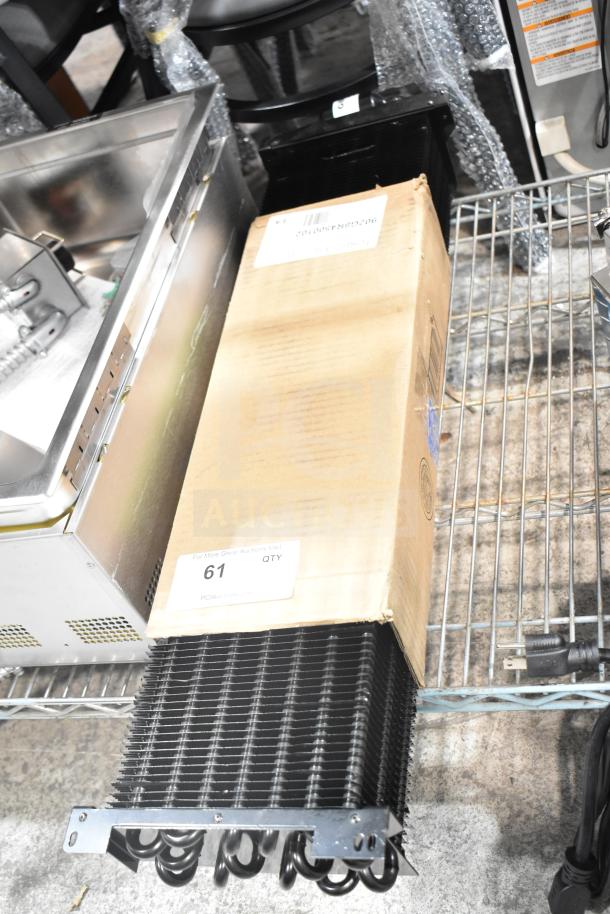 Brand new Turbo Air Refrigeration G8R4500102 evaporator coil, visible in packaging. Scratch and dent condition. Model 902G8R4500102.