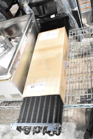 Brand new Turbo Air Refrigeration G8R4500102 evaporator coil, visible in packaging. Scratch and dent condition. Model 902G8R4500102.