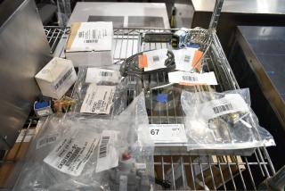 Eight brand new scratch and dent items, including relay, switch, and valve kit, labeled with barcodes and part numbers.