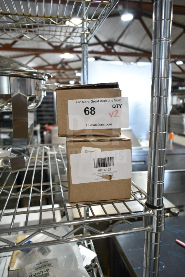 Two brand new "scratch and dent" items in boxes, including a Henny Penny thermostat assembly. Box labeled with "68 QTY V2" from PCI Auctions.